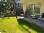 Garden and terrace with sun loungers outside the Calville double room.